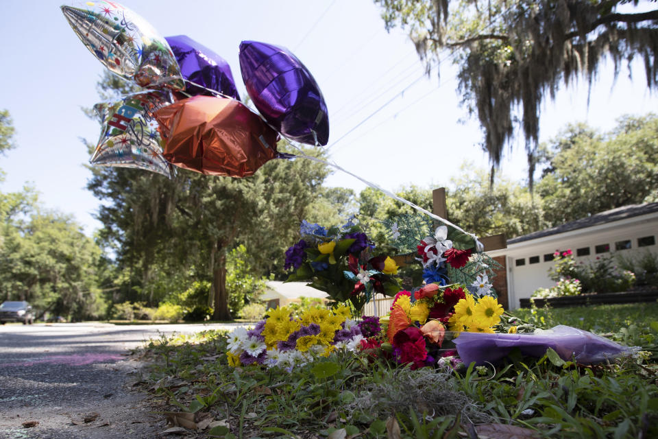 A memorial at the spot where an unarmed black man was shot and killed is shown Friday, May 8, 2020, in Brunswick Ga. Two men have been charged with murder in the February shooting death of Ahmaud Arbery, whom they had pursued in a truck after spotting him running in their neighborhood. (AP Photo/John Bazemore)