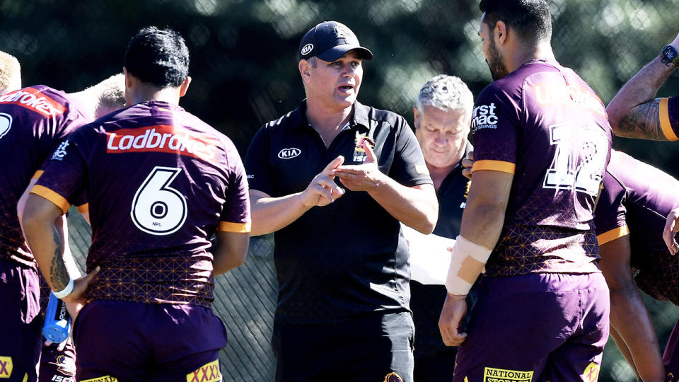 Coach Anthony Seibold gives instructions to the Brisbane Broncos players.