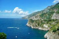 <b>The Amalfi Coast</b>, along the Sorrentine Peninsula, is truly a breathtaking visual, with its deep blue seas, sparkling white villas, and scented lemon groves. 