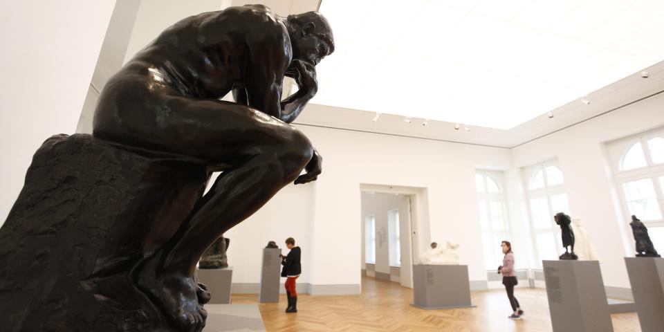  The Statue of the French sculptor Auguste Rodin, The Thinker, stands as the visitors walk among the museum's exhibition spaces during a press preview in Barberini Museum on January 19, 2017 in Potsdam, Germany