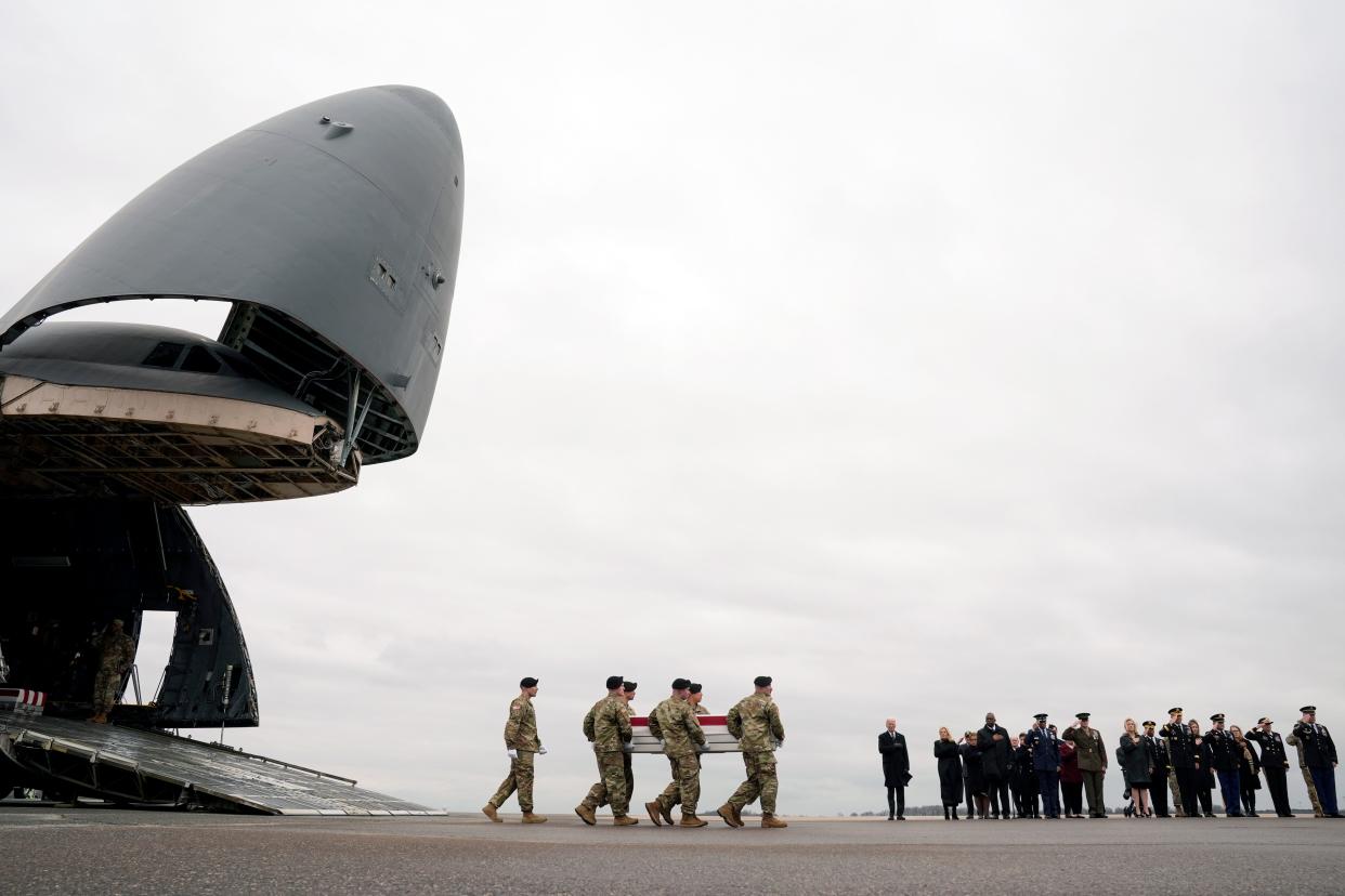 President Joe Biden and first lady Jill Biden stand as an Army carry team moves the transfer case containing the remains of U.S. Army Sgt. William Jerome Rivers, 46, of Carrollton, Ga., at Dover Air Force Base, Del., Friday, Feb. 2, 2024. Rivers was killed in a drone attack in Jordan on Jan. 28. (AP Photo/Matt Rourke) ORG XMIT: DEMR101