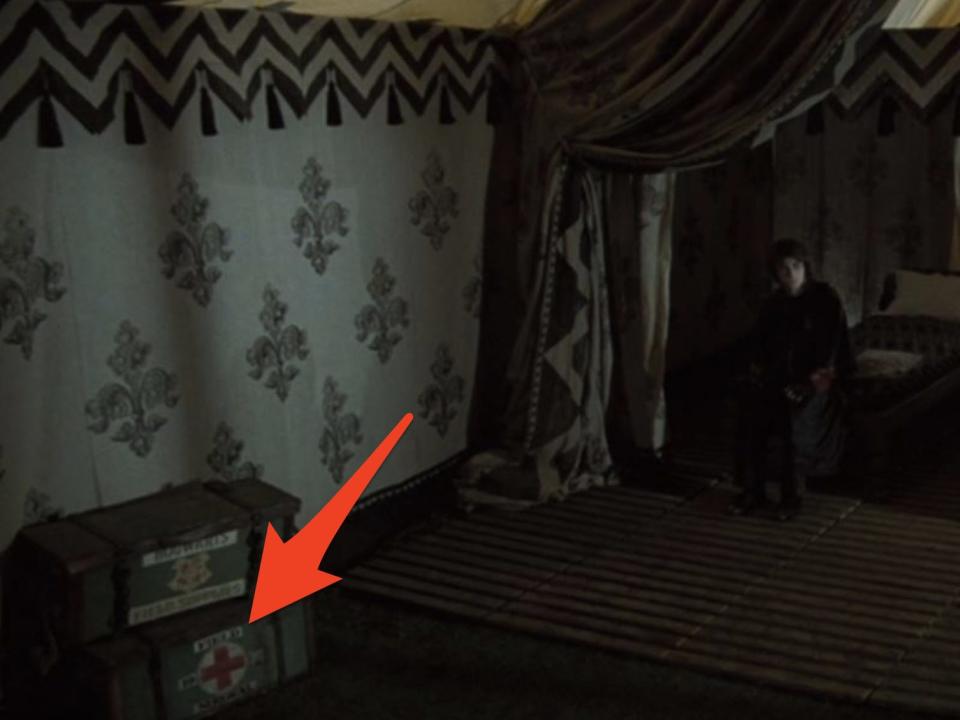 arrow pointing to medical supplies in front of harry in a tent during harry potter and the goblet of fire