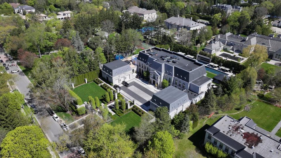 Aerial (Drone) images of the mansion belonging to Drake on the Bridal Path, after overnight shooting. Police tape and TPS shown.