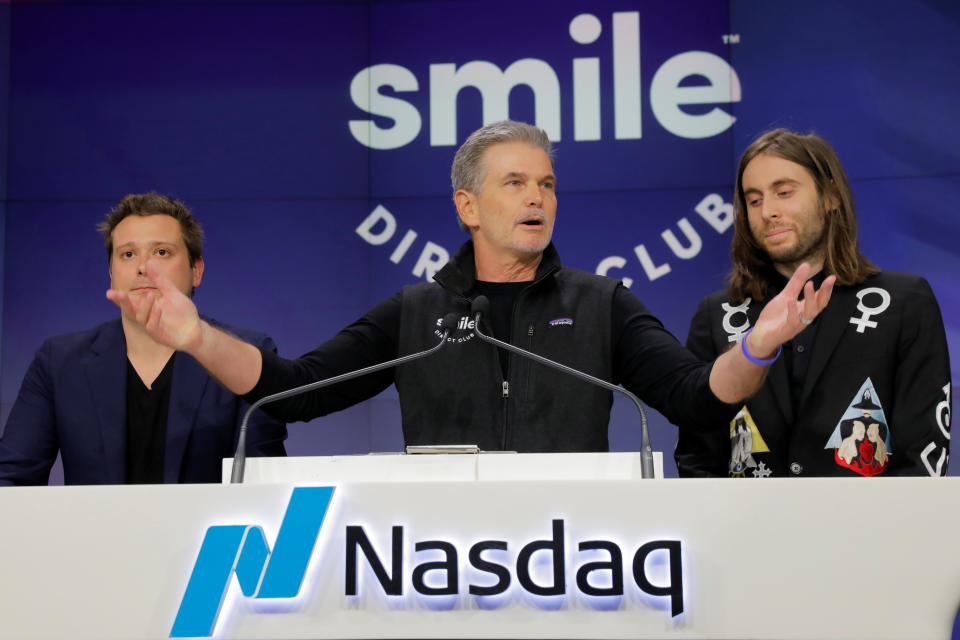 David Katzman, CEO of SmileDirectClub stands with founders Jordan Katzman (R) and Alex Fenkell as the company debuts its IPO at the Nasdaq MarketSite in New York, U.S. September 12, 2019. REUTERS/Lucas Jackson