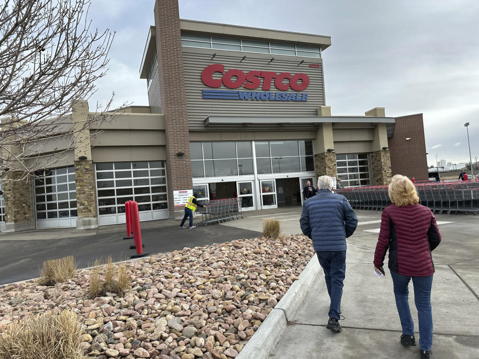 Shoppers head into a Costco warehouse Thursday, Jan. 11, 2024, in Sheridan, Colo. (AP Photo/David Zalubowski)