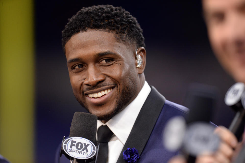 INDIANAPOLIS, IN - DECEMBER 07: FOX Sports analyst Reggie Bush talks with colleagues during the pre-game show for the Big Ten Conference Championship football game between the Wisconsin Badgers and the Ohio State Buckeyes on December 7, 2019, at Lucas Oil Stadium in Indianapolis, Indiana. (Photo by Michael Allio/Icon Sportswire via Getty Images)