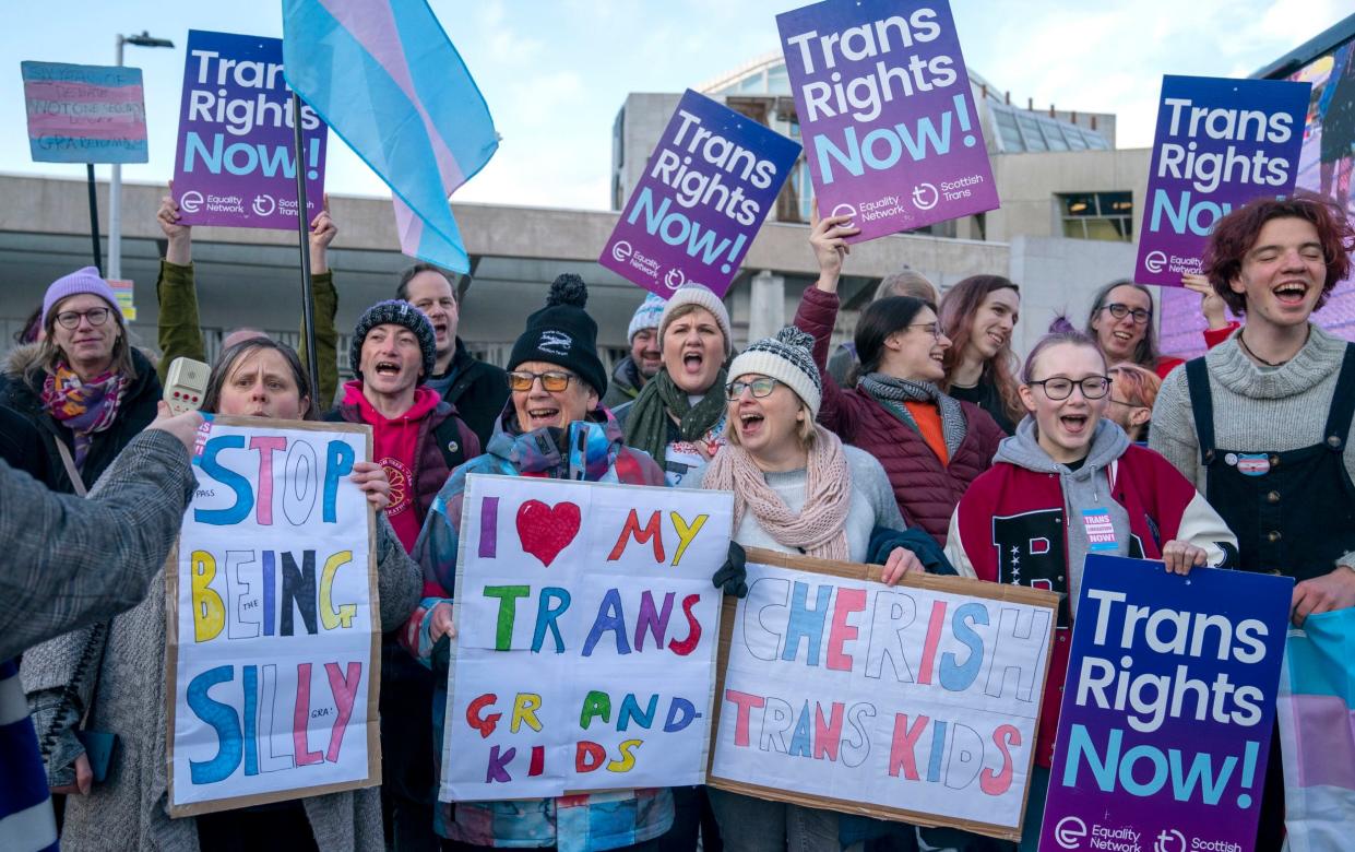 Supporters of the Gender Recognition Reform Bill take part in a protest outside the Scottish Parliament - Jane Barlow/PA