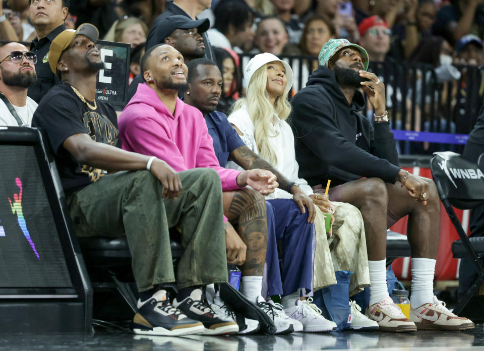 LAS VEGAS, NEVADA - JUNE 15: Bam Adebayo of the Miami Heat, Damian Lillard of the Milwaukee Bucks, Rich Paul, Savannah James and LeBron James of the Los Angeles Lakers attend a game between the New York Liberty and the Las Vegas Aces at Michelob ULTRA Arena on June 15, 2024 in Las Vegas, Nevada. The Liberty defeated the Aces 90-82. NOTE TO USER: User expressly acknowledges and agrees that, by downloading and or using this photograph, User is consenting to the terms and conditions of the Getty Images License Agreement. (Photo by Ethan Miller/Getty Images)