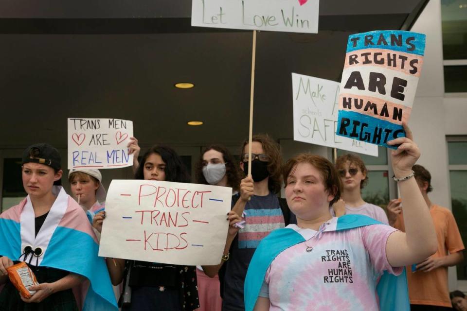 Rylan Mance (right) and fellow Gardner Edgerton high school students protested out side Gardner City Hall after marching there from the school, Friday, Sept. 16, 2022. The students were protesting a proposed transgender bathroom policy.