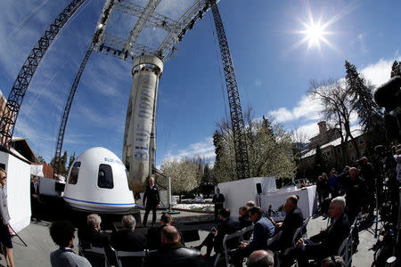 Amazon and Blue Origin founder Jeff Bezos addresses the media about the New Shepard rocket booster and Crew Capsule mockup at the 33rd Space Symposium in Colorado Springs, Colorado, United States April 5, 2017. REUTERS/Isaiah J. Downing