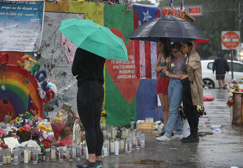 <p>Madison Fisher, Sarah Partenio and Immanuelle Craan (L-R) visit the memorial to the victims of the mass shooting setup around the Pulse gay nightclub one day before the one year anniversary of the shooting on June 11, 2017 in Orlando, Florida. (Joe Raedle/Getty Images) </p>