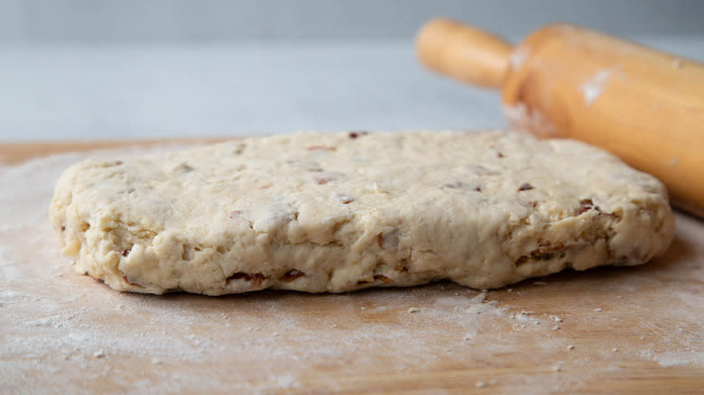 biscuit dough rolled out with rolling pin