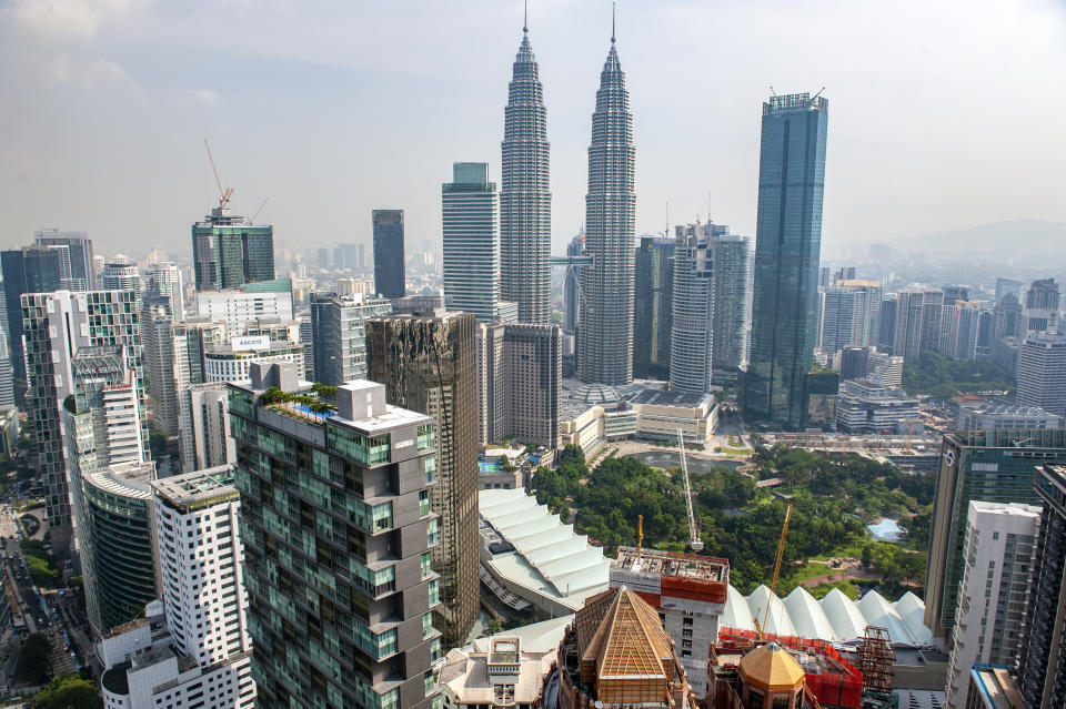 KUALA LUMPUR, FEDERAL TERRITORY OF KUALA LUMPUR, MALAYSIA - 2018/07/27: The view over Kuala Lumpur city center and the Petronas Twin Towers from the top of the Banyan Tree Hotel, Malaysia. (Photo by Leisa Tyler/LightRocket via Getty Images)