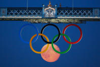 #3 Moon as Olympic ring<br>The full moon rises through the Olympic Rings hanging beneath Tower Bridge during the London 2012 Olympic Games.