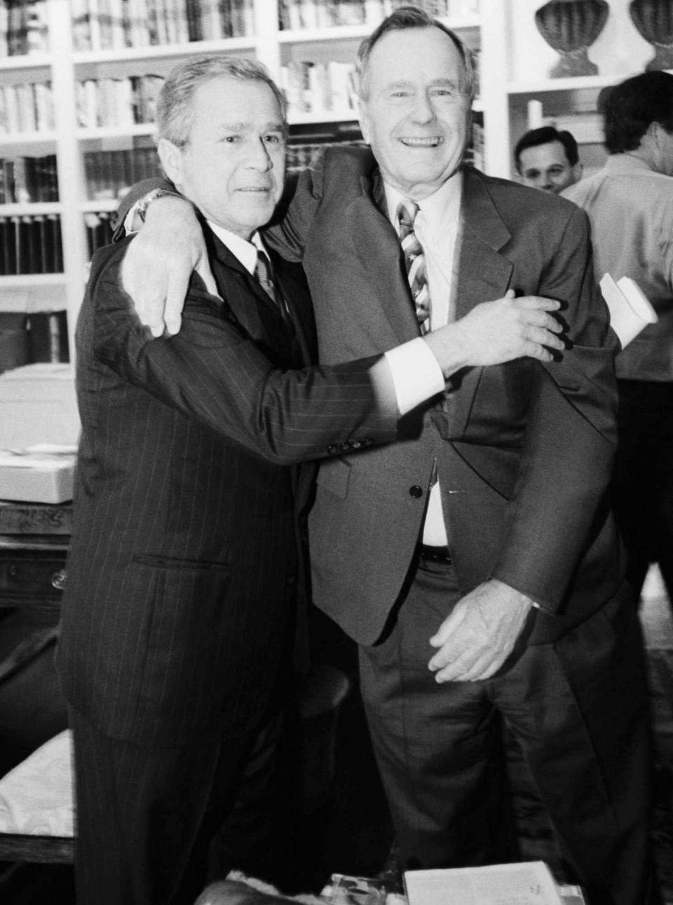 George W. Bush Embracing Father George, Sr