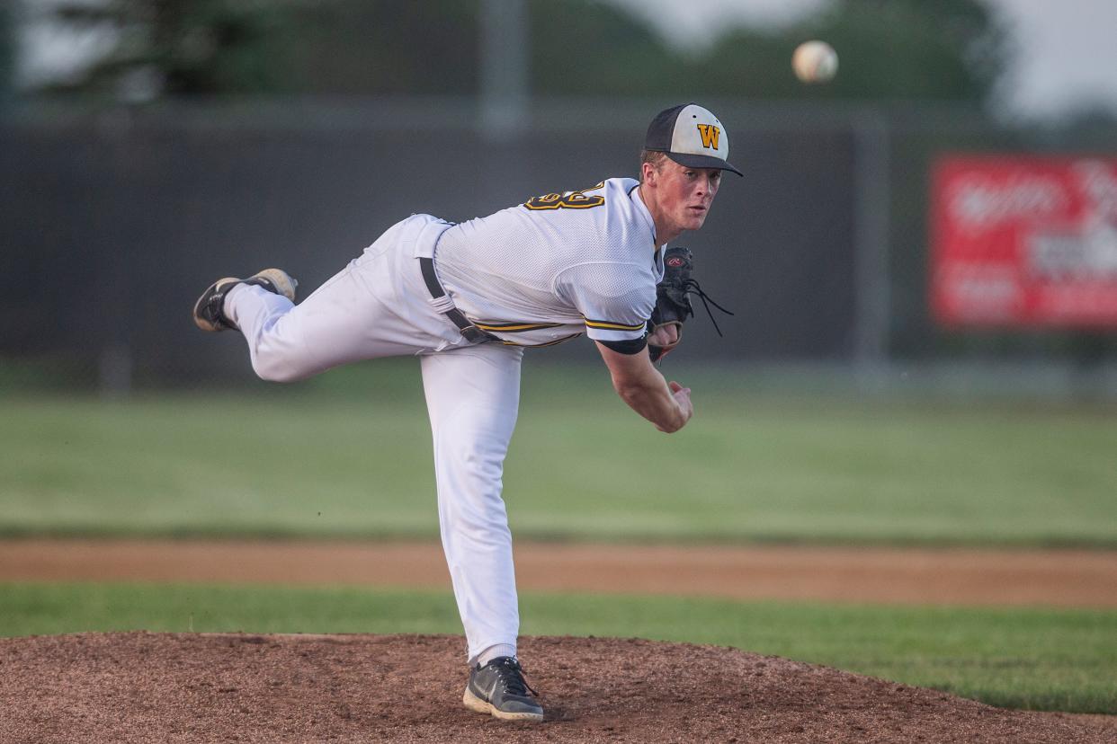 Winterset's Justin Hackett throws a pitch against Carroll on Tuesday at Winterset High School.