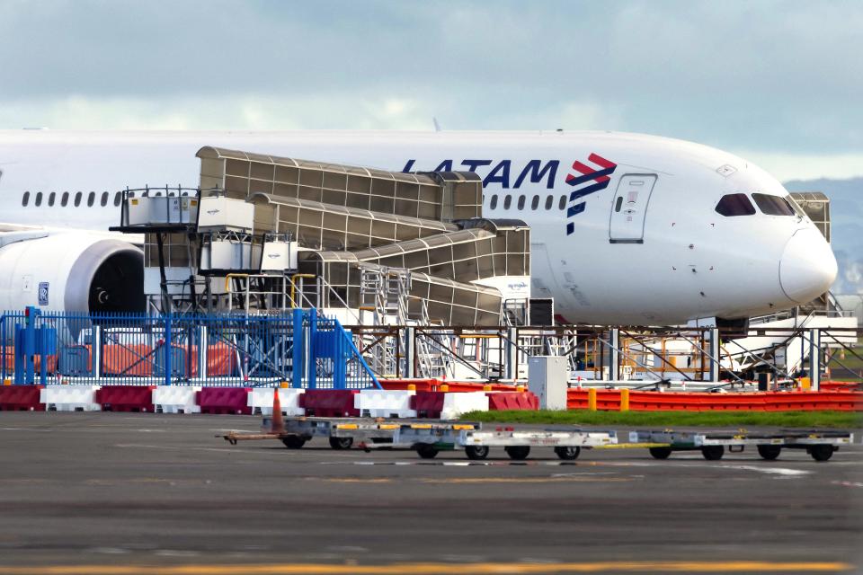 The LATAM Airlines Boeing 787 Dreamliner plane that suddenly lost altitude mid-flight a day earlier, dropping violently and injuring dozens of terrified travellers, is seen on the tarmac of the Auckland International Airport in Auckland on March 12, 2024. (Photo by BRETT PHIBBS / AFP) (Photo by BRETT PHIBBS/AFP via Getty Images)