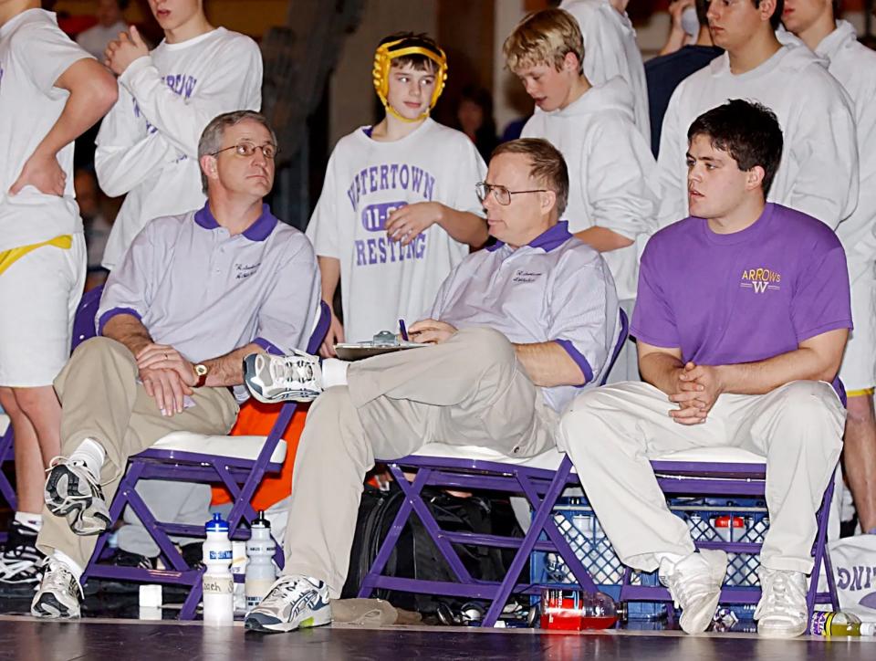 Marv Sherrill, center, is the most successful wrestling coach in South Dakota history — leading the Arrow to more than 500 duals wins (504-151-13), eight state championships and nine state runner-up finishes and 15 Eastern South Dakota Conference championships in 35 years. The 2002-03 season was his final one as the WHS wrestling coach. At left is his longtime assistant Steve Olson.