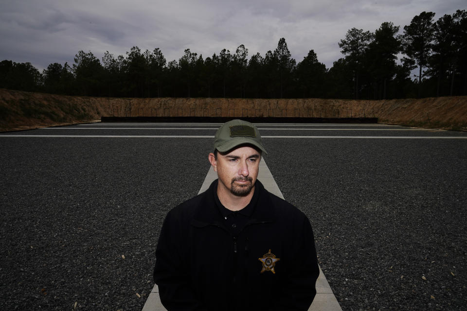 Worth County Sheriff's Lt. Adam Celinski stands for a portrait on Tuesday, Nov. 14, 2023, in Sylvester, Ga. As a sergeant with the Sylvester Police Department in 2016, Celinski responded to a 911 call of a paranoid man banging on the door of a woman’s home. The man, Terrell “Al” Clark, approached Celinski saying he was high and needed help. Celinski’s body-camera video showed he was calm and courteous as he handcuffed the man. Clark also was polite, but neighbors watched as he began to struggle and the officer got Clark facedown on some roadside grass, using a knee and hand to ensure he stayed there. (AP Photo/Brynn Anderson)