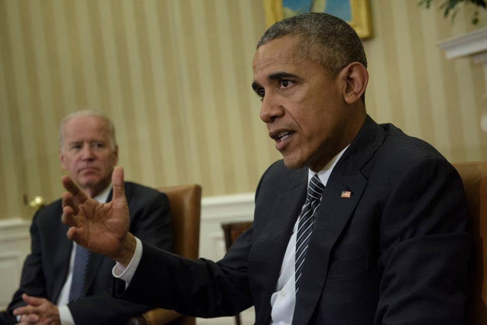 Vice President Joe R. Biden (L) listens as President Barack Obama speaks in the Oval Office of the White House on May 21, 2016. (BRENDAN SMIALOWSKI/AFP via Getty Images)