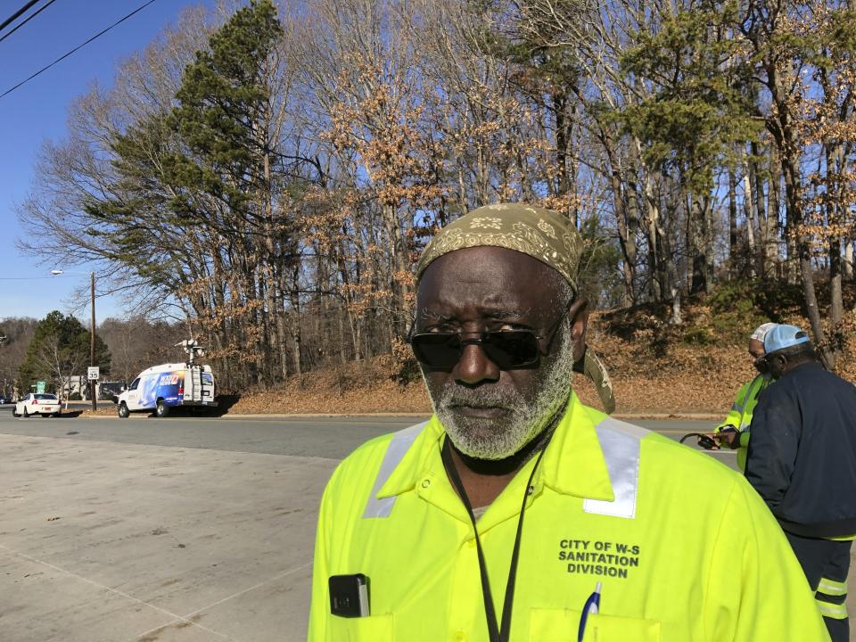 Winston-Salem, North Carolina, sanitation worker Dwight Black stands outside his workplace on Friday, Dec. 20, 2019 after reports of gunshots. Winston-Salem City Manager Lee Garrity said in an email that a couple of city employees are dead and some people are injured. He said the wounded have serious but not life-threatening injuries. (AP Photo/Skip Foreman)