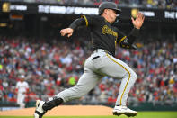 Pittsburgh Pirates catcher Henry Davis rounds first for a double during the first inning of an opening-day baseball game against the Washington Nationals at Nationals Park, Monday, April 1, 2024, in Washington. (AP Photo/John McDonnell)
