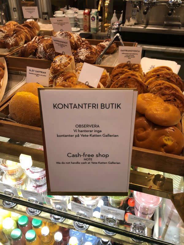 FILE PHOTO: A sign informing that cash payments are not accepted is seen at a cafe in Stockholm