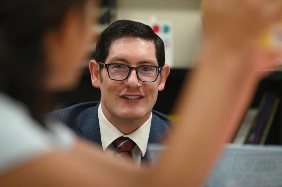Dr. Gregory Monroe, superintendent of the Diocese of Charlotte Schools smiles as he talks with a student at Charlotte Catholic High School on Wednesday, August 16, 2023. Wednesday is the first day of school for the students.