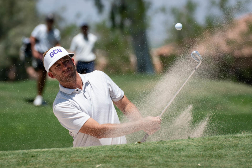 Jesse Mueller hits out of the sand on the first hole, August 1, 2022, during the 2022 Arizona Open at Mesa Country Club, 660 W Fairway Dr., Mesa, Arizona.
