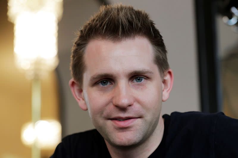 Austrian lawyer and privacy activist Schrems smiles during a Reuters interview in Vienna