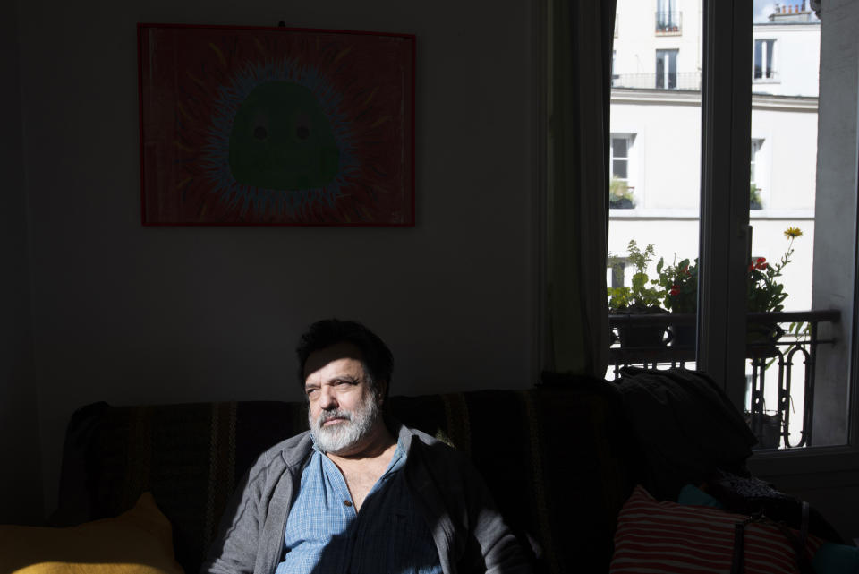 Photographer Joao Luiz Bulcao, of Brazil, rests in his apartment in the Montmatre district of Paris on May 23, 2021. After more than a year with no work, he is starting to get commissions again from tourists and romantics who hire him for artful souvenir photos in Paris, to immortalize their memories made in the City of Light. (AP Photo/Joao Luiz Bulcao)