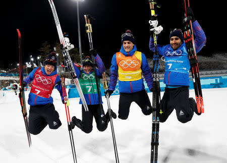 Biathlon - Pyeongchang 2018 Winter Olympics - Mixed Relay Final - Alpensia Biathlon Centre - Pyeongchang, South Korea - February 20, 2018 - Gold medalists: Martin Fourcade, Simon Desthieux, Marie Dorin Habert and Anais Bescond of France celebrate. REUTERS/Murad Sezer