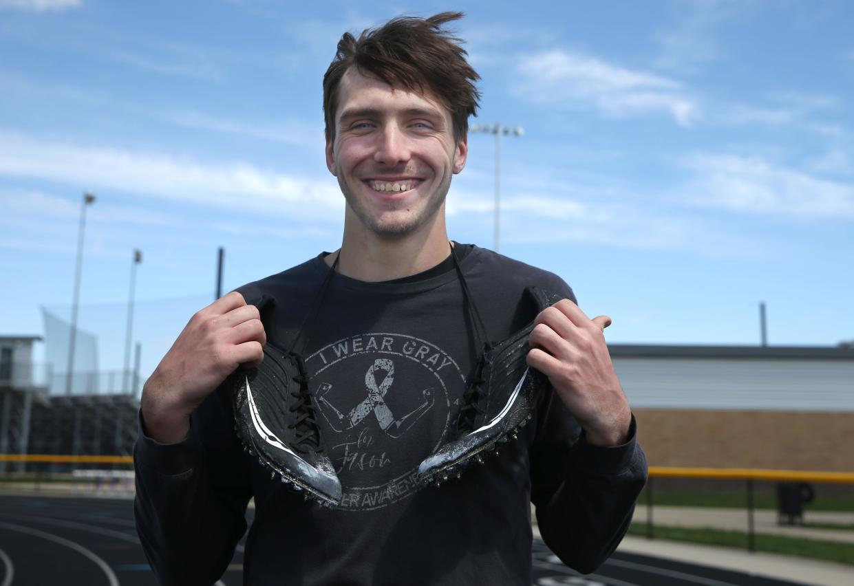 Brady Cannon poses for a portrait at Liberty's track and field in North Liberty, Iowa.
