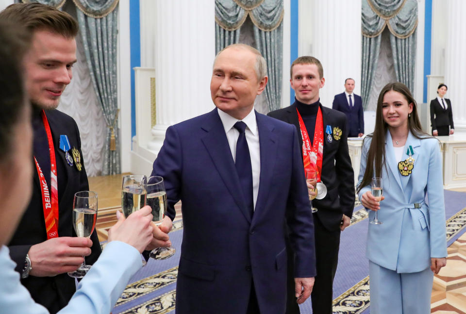 FILE - Russian President Vladimir Putin meets with Russian athletes during an awarding ceremony for the Russian Olympic Committee's medalists of the XXIV Olympic Winter Games in Beijing and members of the Russian Paralympic team in the Kremlin in Moscow, Russia, Tuesday, April 26, 2022. (Mikhail Klimentyev, Sputnik, Kremlin Pool Photo via AP, File)