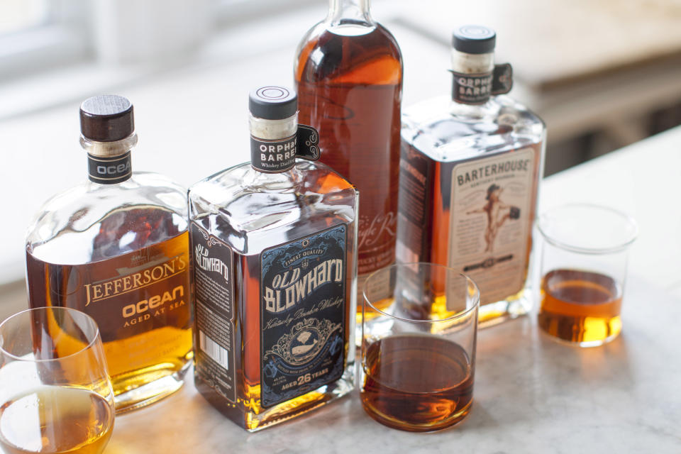 This Apr. 7, 2014 photo shows Jefferson's Ocean, Old Blowhard, Eagle Rare, and Barterhouse bourbons in Concord, N.H. All are part of a bourbon renaissance that has seen a new appreciation of American whiskey, as well as the birth of a whole new class of cult spirits. (AP Photo/Matthew Mead)