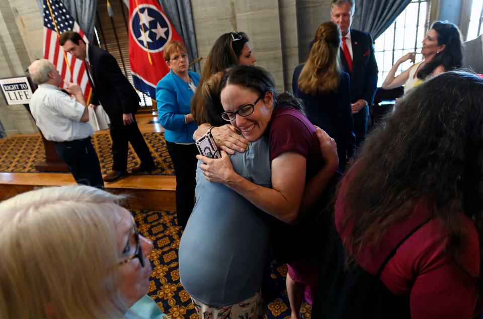 Tennessee Right to Life supporter Maria Macias, receives a hug a press conference on Friday, June 24, 2022, in Nashville, Tenn. The United States Supreme Court overturned Roe v. Wade, ending constitutional right to abortion.  