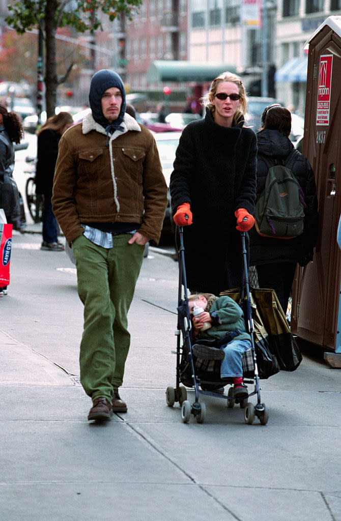 walking on the street with baby Maya in a stroller