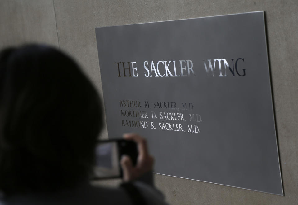 A sign with some names of the Sackler family is displayed at the Metropolitan Museum of Art in New York, Thursday, Jan. 17, 2019. The Sackler name adorns walls at some of the world's top museums and universities, including the Met, the Guggenheim and Harvard. But the family's ties to the powerful painkiller OxyContin and the drug's role in the nation's deadly opioid crisis are bringing a new kind of attention to the Sacklers and their philanthropic legacy. (AP Photo/Seth Wenig)