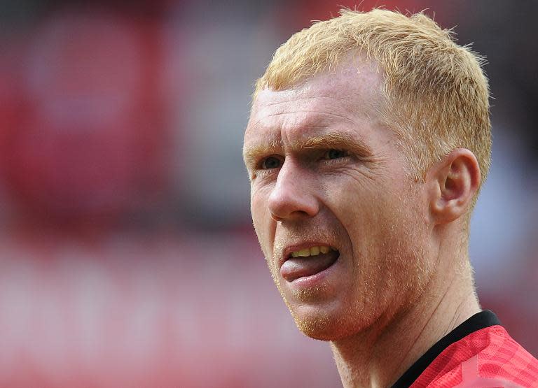 Manchester United legend Paul Scholes leaves the pitch after a charity football match between Man United Legends and Real Madrid Legends, at Old Trafford in Manchester, north-west England, on June 2, 2013