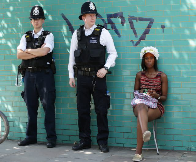 Police and a spectator along the route