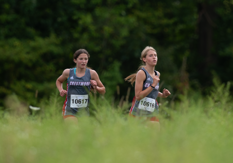 Crestwood runners Piper Seibold, 617, and Madie Grace Gonczy, 616, finish second and third at the Streetsboro Rockets XC Invitational on Saturday.