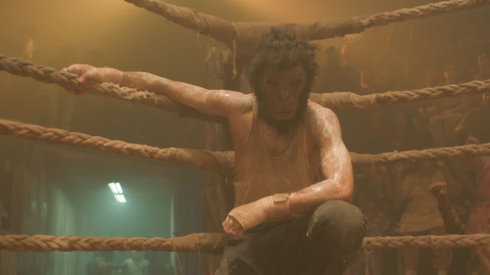 The film's Kid (Patel) is inspired by the tales of Hanuman from his childhood and dons a monkey mask as he fights in an underground boxing club. - Universal Pictures