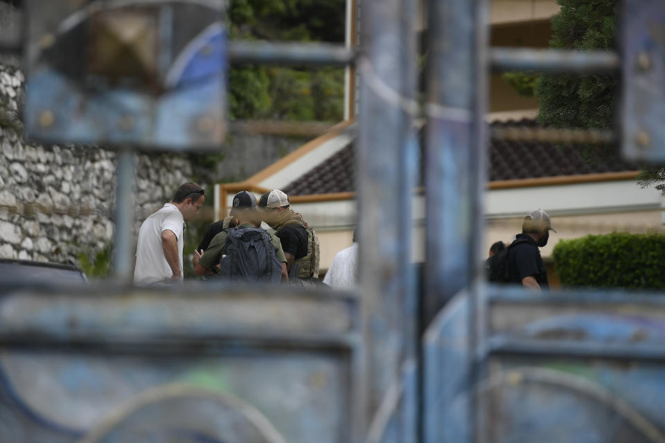 FBI agents assisting in the investigation over the assassination of Haiti´s President Jovenel Moise inspect his residence in Port-au-Prince, Haiti, Thursday, July 15, 2021. President Moise was assassinated at his home on July 7. (AP Photo/Matias Delacroix)