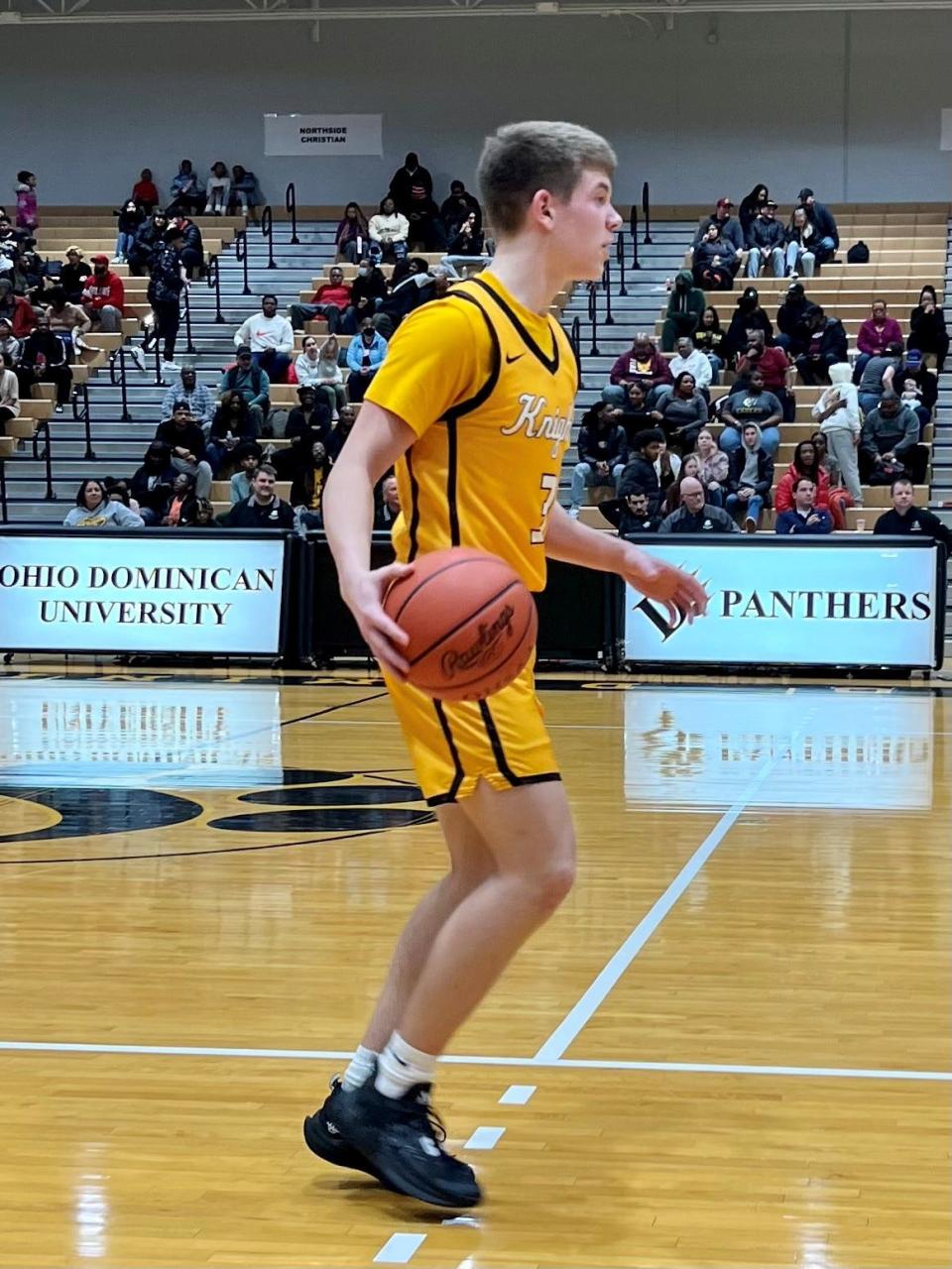 Northmor's Jax Wenger brings the ball up the court during a Division IV boys basketball district championship game against Patriot Prep at Ohio Dominican University's Alumni Hall Friday night.