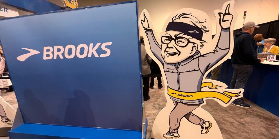 A cardboard cutout of Warren Buffett winning a race.