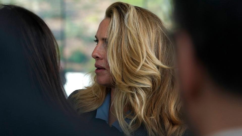 Mandatory Credit: Photo by Tony Avelar/AP/Shutterstock (10167440a)Laurene Powell, the widow of Steve Jobs, waits to enter the Steve Jobs Theater for an event to announce new products, in Cupertino, CalifApple Streaming TV, Cupertino, USA - 25 Mar 2019.