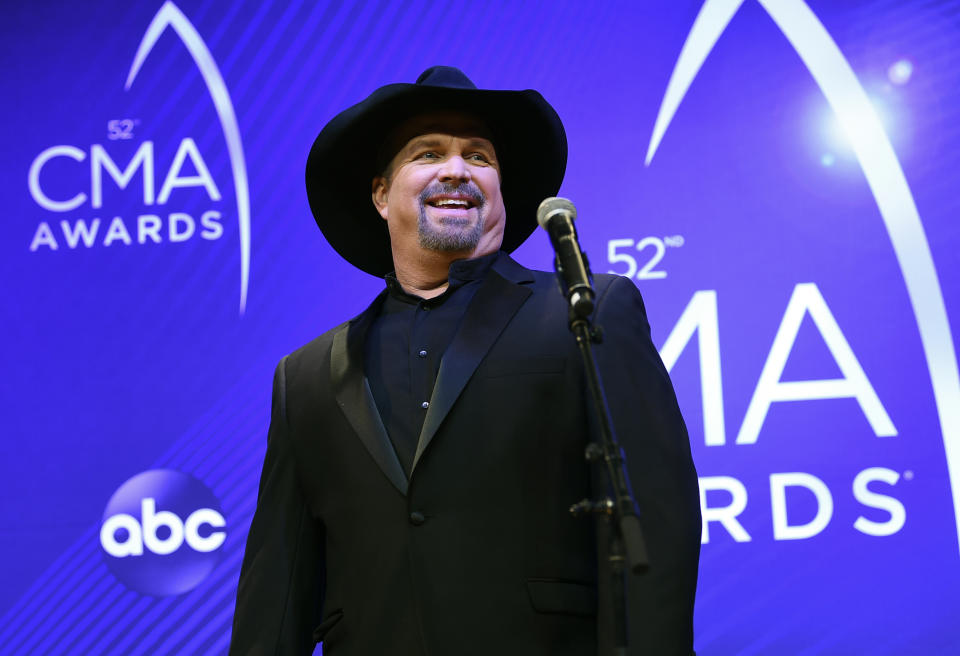 FILE - Singer/songwriter Garth Brooks appears at the 52nd annual CMA Awards in Nashville, Tenn. on Nov. 14, 2018. Brooks says he is pulling himself out of nominations for the Country Music Association's entertainer of the year award, saying it's time for someone else to win the top prize. Brooks, who won the top prize last November, said during an online press conference on Wednesday that he doesn't want to be nominated in any upcoming years as well. (Photo by Evan Agostini/Invision/AP, File)