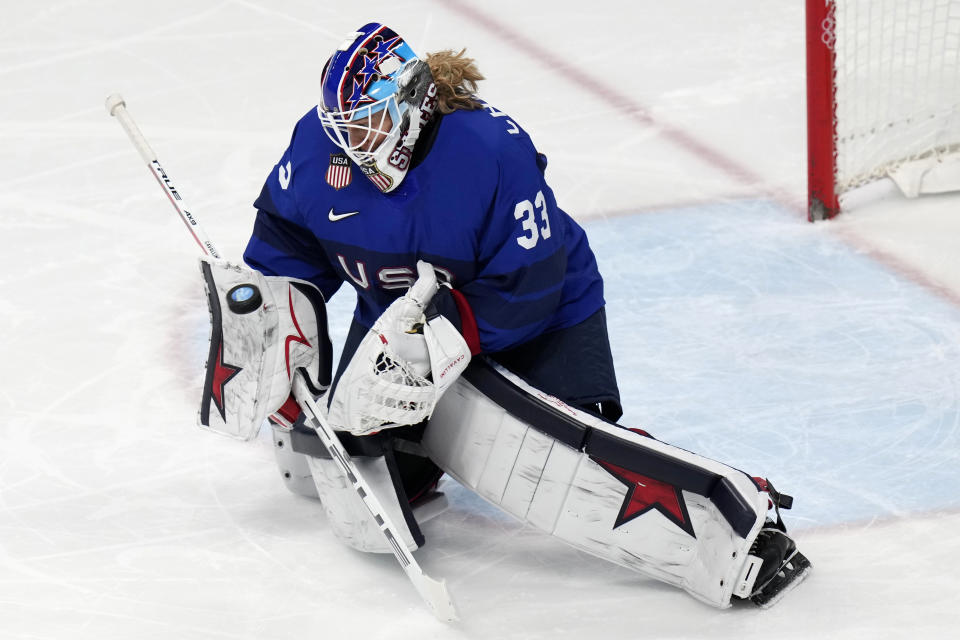 United States goalkeeper Alex Cavallini (33) blocks a shot during a women's quarterfinal hockey game against the Czech Republic at the 2022 Winter Olympics, Friday, Feb. 11, 2022, in Beijing. (AP Photo/Petr David Josek)