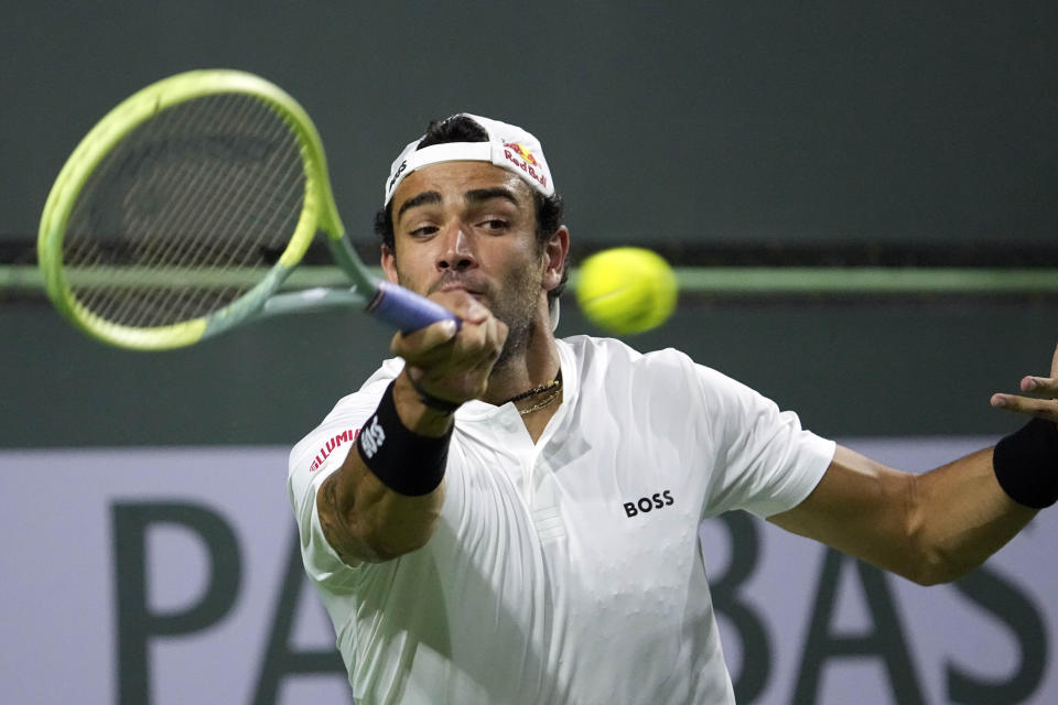 Matteo Berrettini, of Italy, returns a shot to Taro Daniel, of Japan, at the BNP Paribas Open tennis tournament Friday, March 10, 2023, in Indian Wells, Calif. (AP Photo/Mark J. Terrill)