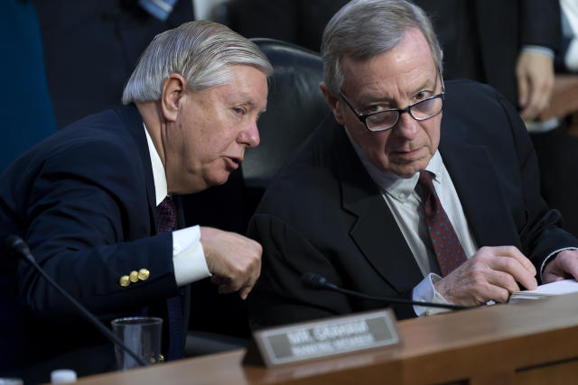 Sen. Lindsey Graham, R-S.C., left, the ranking member of the Senate Judiciary Committee, confers with Chairman Dick Durbin, D-Ill., during debate over judicial appointments, at the Capitol in Washington, Thursday, May 11, 2023. (AP Photo/J. Scott Applewhite)